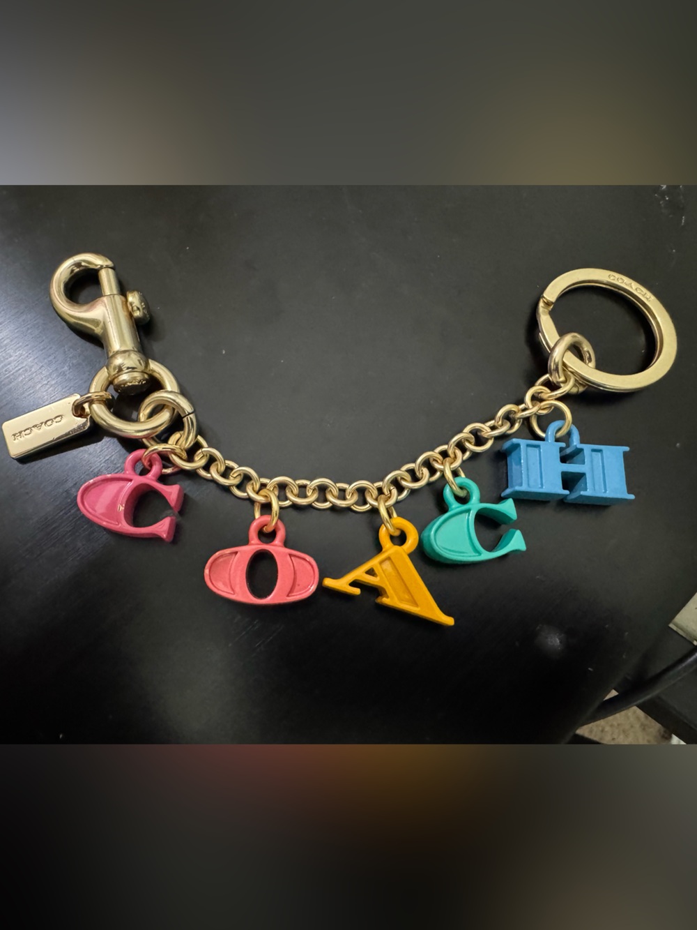 Coach Gold-Tone Keychain with Pink, Coral, Yellow, Teal, and Blue Enamel Charms